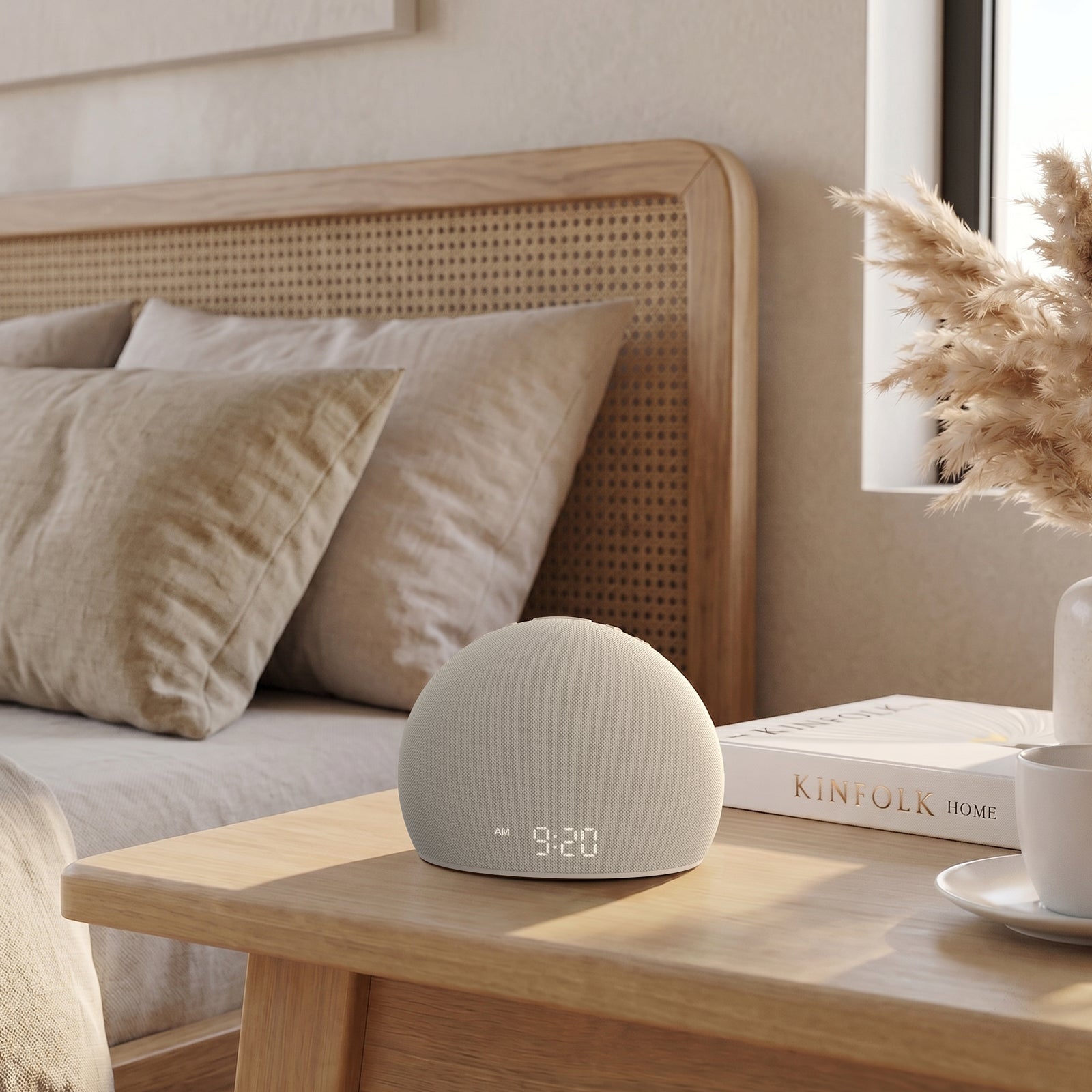 The sleek, modern Housbay Dawn wake-up light integrated seamlessly into a neutral-toned bedroom decor on a wooden bedside table.