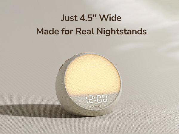 Compact HOUSBAY bedside clock designed to fit comfortably on a real nightstand