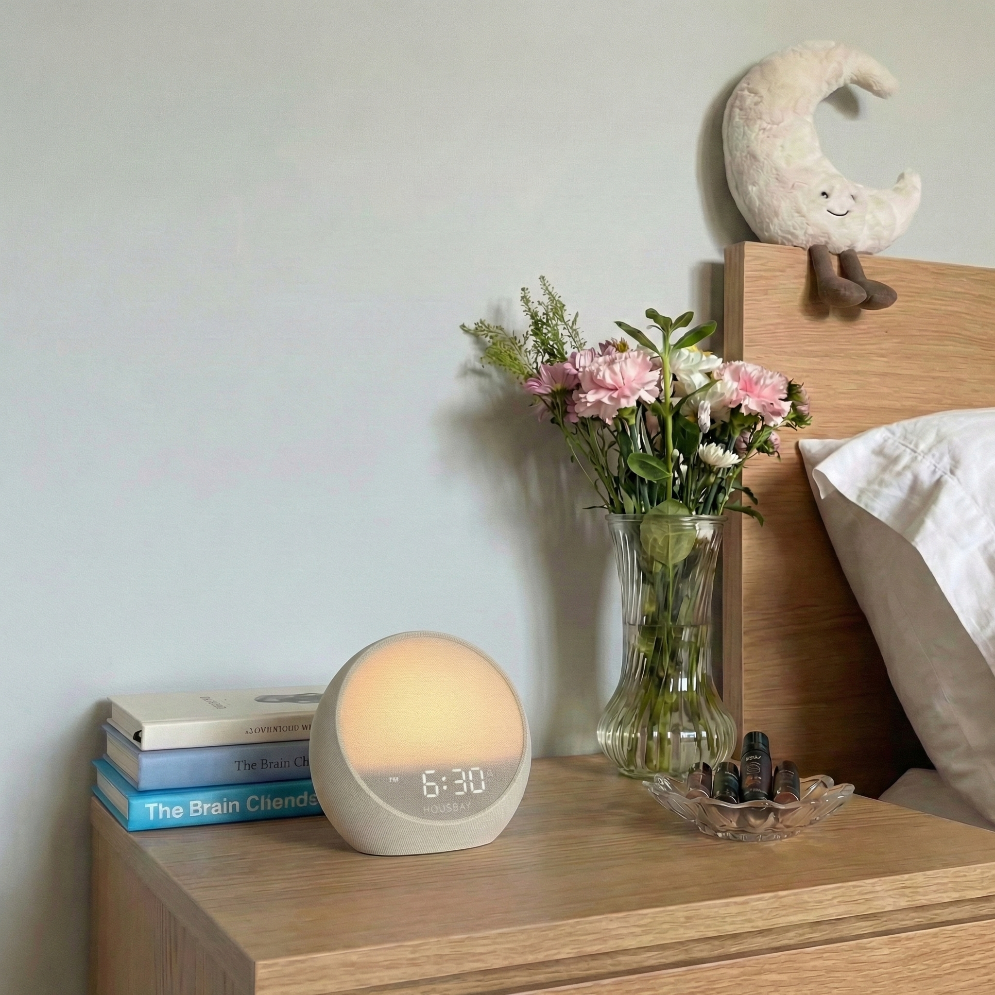 HOUSBAY MINI on a bedside table in a calm minimalist bedroom