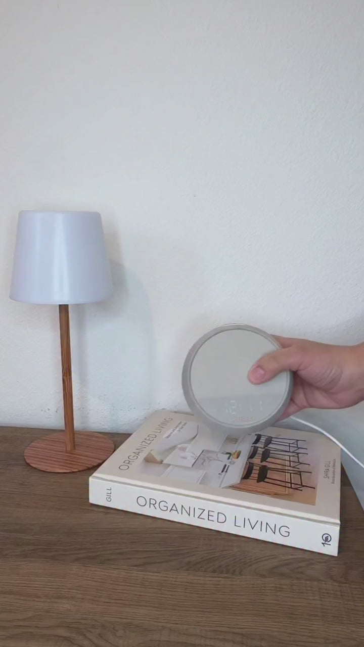 User showing HOUSBAY Mini on a nightstand during a relaxing bedtime routine